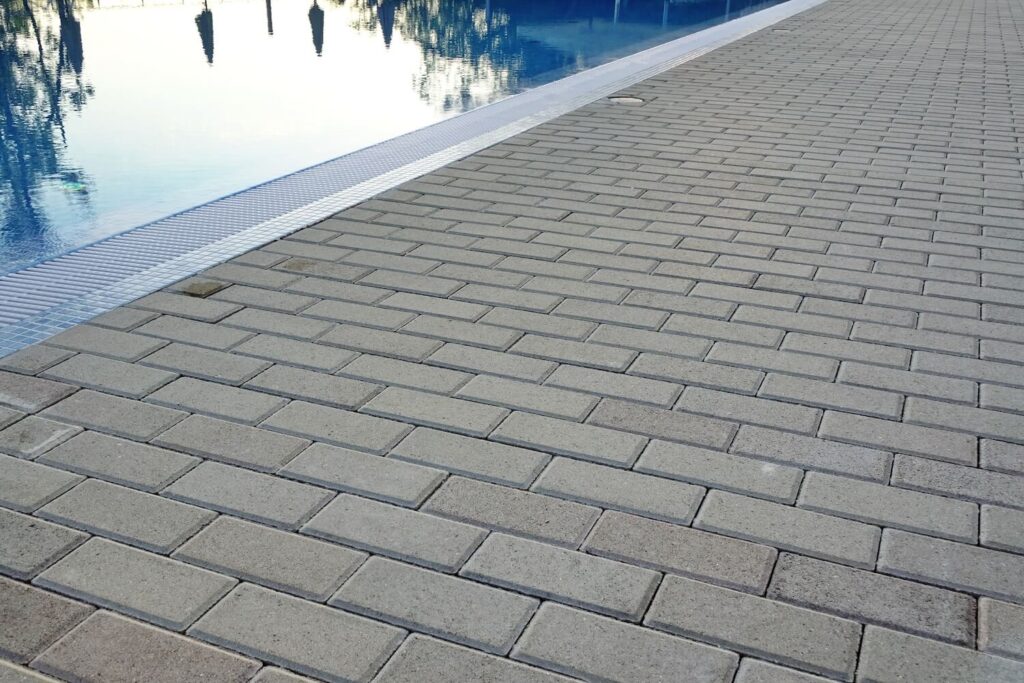 How a Paver Pool Deck Keeps Your Backyard Safe and Gorgeous outdoor moss gravel
