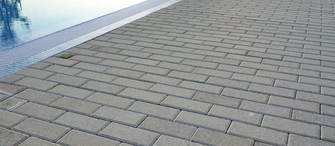 How a Paver Pool Deck Keeps Your Backyard Safe and Gorgeous outdoor moss gravel
